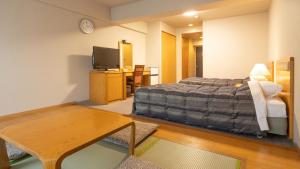 Postel nebo postele na pokoji v ubytování Hyper Resort Villa Shionoe
