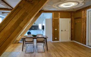a kitchen with a table and chairs in a room at Lady Milavie apartments in Coburg