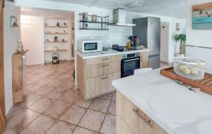 a kitchen with a counter and a microwave in it at 1 Bedroom Cozy Apartment In Toulon in Toulon