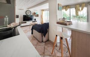 a kitchen and living room with a sink and a counter at 1 Bedroom Cozy Apartment In Toulon in Toulon