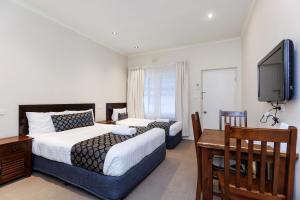 Amaroo Motel Tumuts Best Accommodation客房内的一张或多张床位