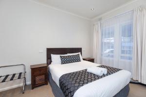 Amaroo Motel Tumuts Best Accommodation客房内的一张或多张床位