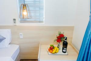 a tray of fruit on a table in a hotel room at Lee House Villa Tam Thanh in Tam Ky