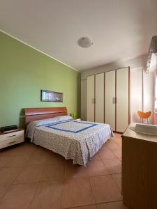 En eller flere senge i et værelse på Casa Letizia