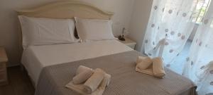 Ένα ή περισσότερα κρεβάτια σε δωμάτιο στο AltaMarea Apartment