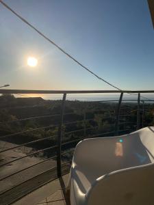 a view of the sun setting from a gondola at Etna Stone Rooms in Zafferana Etnea +38 photos