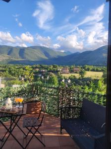 a patio with a table and chairs and mountains at Emme House Bed&Breakfast in Pontecorvo