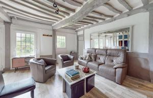 a living room with a couch and a table at Beautiful Home In Vittefleur With Wifi in Vittefleur