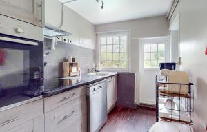 a kitchen with a sink and a counter top at Beautiful Home In Vittefleur With Wifi in Vittefleur +16 photos