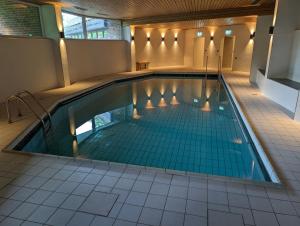 Bazén v ubytování Apartment mit Balkon und Pool, zentral am Waldrand nebo v jeho okolí