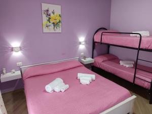 Postel nebo postele na pokoji v ubytování B&B Il Gioiello