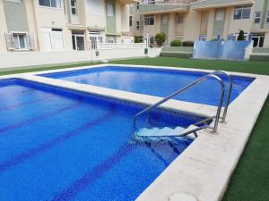 The swimming pool at or close to Delfines III Solo Familias Serviplaya