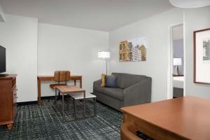 A seating area at Homewood Suites by Hilton Omaha - Downtown