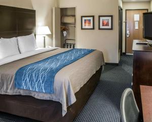 a hotel room with a large bed and a desk at Comfort Inn Gallup I-40 Exit 20 in Gallup