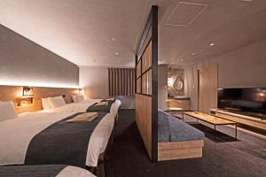 Voodi või voodid majutusasutuse hotel around TAKAYAMA, Ascend Hotel Collection toas