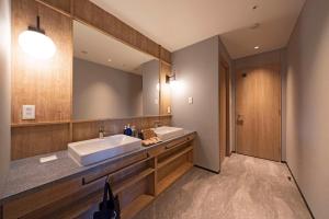 Voodi või voodid majutusasutuse hotel around TAKAYAMA, Ascend Hotel Collection toas