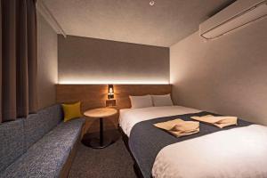 Voodi või voodid majutusasutuse hotel around TAKAYAMA, Ascend Hotel Collection toas