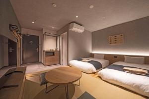 Voodi või voodid majutusasutuse hotel around TAKAYAMA, Ascend Hotel Collection toas