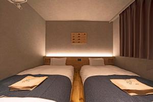 Voodi või voodid majutusasutuse hotel around TAKAYAMA, Ascend Hotel Collection toas