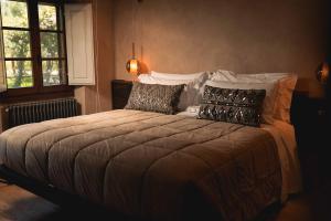 Voodi või voodid majutusasutuse Borgo I Vicelli Adults Only Relais toas