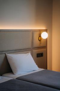 Ένα ή περισσότερα κρεβάτια σε δωμάτιο στο Karras Grande Resort