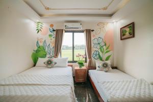 Ліжко або ліжка в номері Bungalow - Tam Coc Ninh Binh