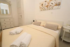 Postel nebo postele na pokoji v ubytování Mamma Mia Apartments
