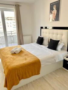 JAD - Comfortable - Apartments - Coresi tesisinde bir odada yatak veya yataklar