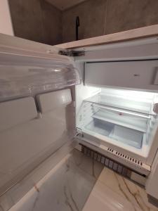 an empty refrigerator with its door open at Maria Luxury Apartament Golf del Sur Tenerife in San Miguel de Abona +53 photos
