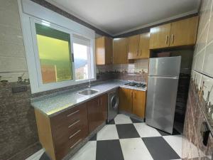 Kuchyň nebo kuchyňský kout v ubytování Dina Apartments