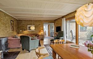 a living room with a couch and a table at Pet Friendly Home In Bandholm With Wifi in Bandholm