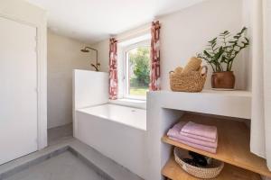 a bathroom with a sink and a window at Gîte de Fompesquiere in Frespech +36 photos