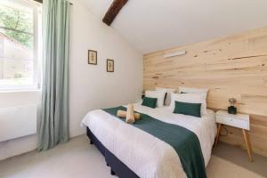 a bedroom with two beds and a window at Gîte de Fompesquiere in Frespech