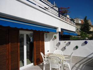 a table and chairs sitting outside of a building at brisa mar in San Pol de Mar