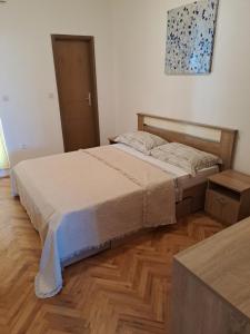 Postel nebo postele na pokoji v ubytování Apartments Villa Toma