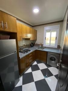 Kuchyň nebo kuchyňský kout v ubytování Dina Apartments