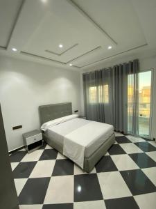 Postel nebo postele na pokoji v ubytování Dina Apartments