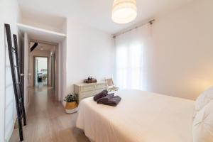 Ένα ή περισσότερα κρεβάτια σε δωμάτιο στο TrendyHomes Almerimar II +41 φωτογραφίες
