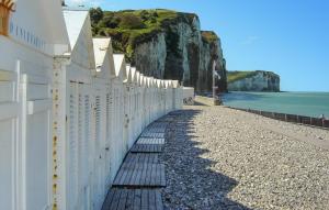 a white wall on a beach next to the ocean at Awesome Home In Arques La Bataille in Arques-la-Bataille +19 photos