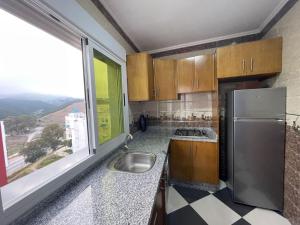Kuchyň nebo kuchyňský kout v ubytování Dina Apartments