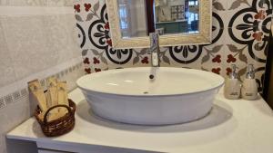 a bathroom with a sink with a mirror at Mận Đào Villa in Ho Chi Minh City +58 photos