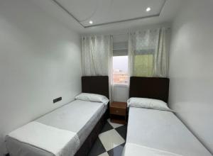 Postel nebo postele na pokoji v ubytování Dina Apartments