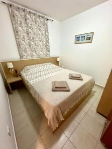 En eller flere senge i et værelse på Sun Bay Petrovac