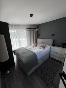 Postel nebo postele na pokoji v ubytování Pokoje I Apartamenty Polna 19