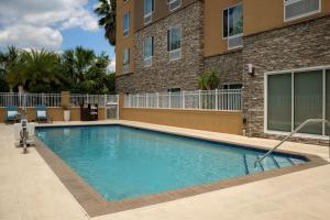 a swimming pool in front of a building at TownePlace Suites by Marriott Gainesville Northwest in Gainesville