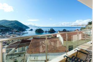 a balcony with a view of the water at Alegeo Apartment in Parga