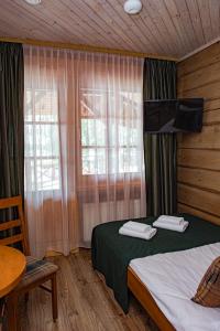 Postel nebo postele na pokoji v ubytování Porto Resort