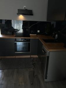 Kuchyň nebo kuchyňský kout v ubytování Pokoje I Apartamenty Polna 19
