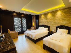 Postel nebo postele na pokoji v ubytování Hotel Matina Suites