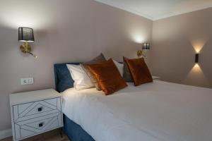 Ένα ή περισσότερα κρεβάτια σε δωμάτιο στο A&T Ultracentral Luxury Loft